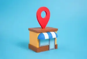 Stilisierte Ladenfront mit Standort-Pin auf blauem Grund, Symbolbild für das Google-Unternehmensprofil